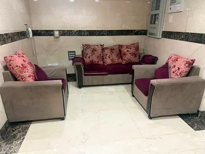 3-piece living room sofa set with floral cushions - good condition