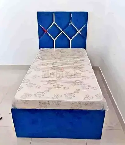 Single blue upholstered bed with mattress - good condition