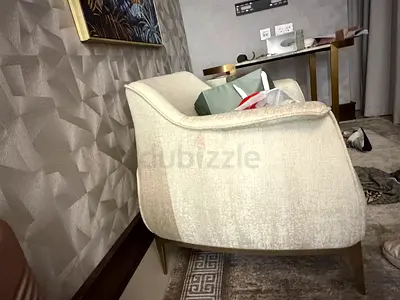Beige Upholstered Accent Armchair with Wooden Legs bought at 5800 aed new
