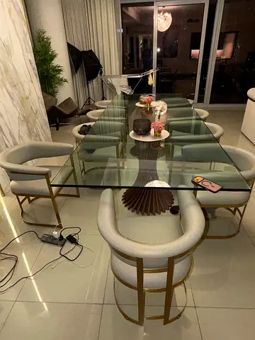 Glass Top Dining Table with 8 Upholstered Chairs - Modern Set bought at 12,000 aed selling 900 aed