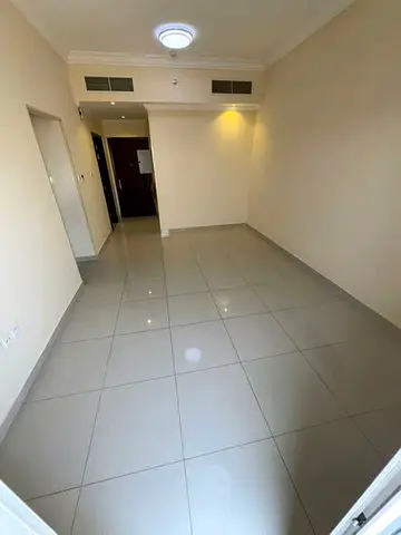 Brand new + built-in wardrobes + elegant finishing, 1BR + hall in Al Jurf 3 Ajman, 2 baths, spaciou