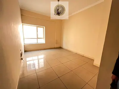 Studio for annual rent in Al Majaz 3 Sharjah contract certification included spacious layout modern finishing open view separate kitchen central air c