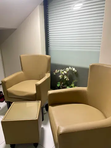 Set of 2 Beige Leather Armchairs with Ottoman - Good Condition