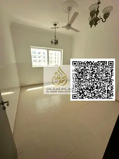 For rent in Al Nuaimiya, Al Ittihad Street: a fully renovated two-bedroom apartment with a living ro