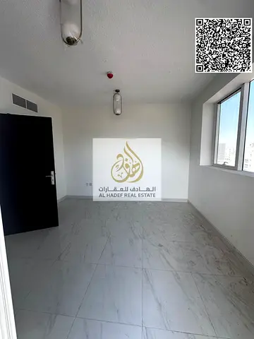 One bedroom, living room, balcony, two bathrooms, and kitchen. Main street, prime location in Al-Jarf 3.