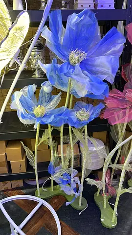 Decorative blue oversized fabric flower floor display