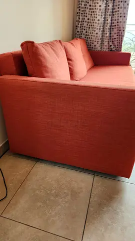 3-seater orange sofa-bed in an excellent condition