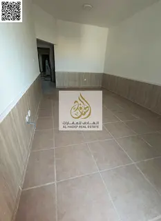 A well-maintained apartment for annual rent in Al Rawda 2, featuring a large layout and practical de