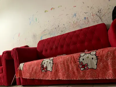 Red tufted 3-seater sofa with matching armchair (good condition)
