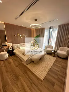Own a fully furnished two-bedroom apartment with a living room in the Tiger Downtown Ajman project w