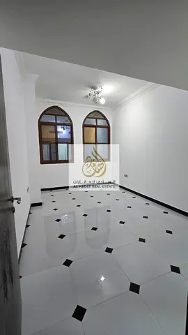 Al Rawda 3, near Khartoum Street, close to the Dubai and Sharjah exit - 2 bedrooms, living room, 2 bathrooms with balcony - Super deluxe finishing, sp