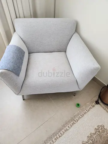 Light grey fabric armchair in good condition