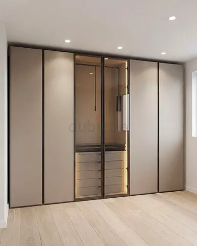 Modern built-in wardrobe with glass display and LED lighting