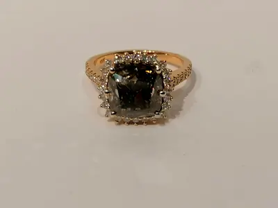 Gold ring with large center Diamond and halo of small diamonds
