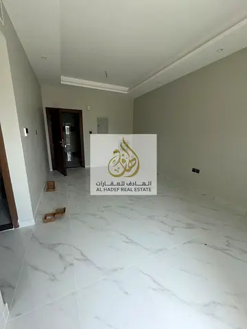 Annual rent in Ajman, Al Jurf 2, near the school complex, next to the community center. New building, first occupancy, two bedrooms, living room, cent