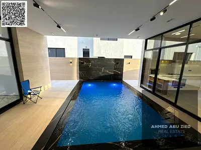 Luxury villa for sale in Al-Haliou, high-end finishing, including water, electricity, and central air conditioning, with a prime location, spacious ar
