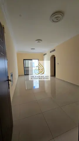 Two bedrooms and a living room with two bathrooms. Second tenant in a prime location in Ajman. Large area, open view, and central air conditioning.
