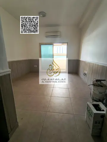 One-bedroom apartment with a living room for annual rent at a special price, with private parking, in the Rawda area.