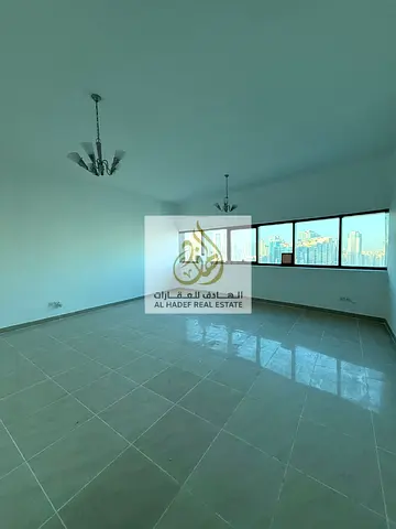 Annual Rental Apartment in Sharjah Mamzar Al Taawun Two Bedroom Hall with Maid Room Built in Wardrobes Prime Location on Dubai Exit 2 Gyms 2 Swimming