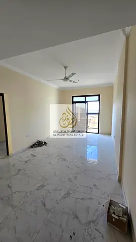 Two bedrooms, a living room, and three bathrooms. First occupancy. Close to the Dubai and Sharjah exit. Excellent location, very spacious, and with an