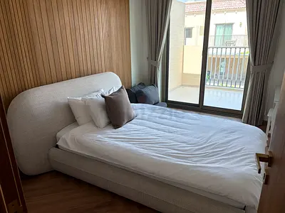 Light grey upholstered double bed with curved headboard. Selling the bed, mattress and bedding.