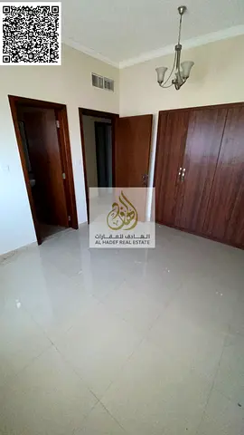 For annual rent in Ajman — a 2-bedroom apartment with a living room, 4 bathrooms, a balcony, a maid's room, and built-in wardrobes, with one month fre