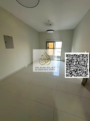 One-bedroom apartment for rent in Al Jurf 2, Ajman, next to City Centre and Radisson Blu Hotel. Features 2 bathrooms, balcony, built-in wardrobes, sup
