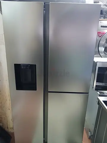 Large stainless steel side-by-side refrigerator with water dispenser