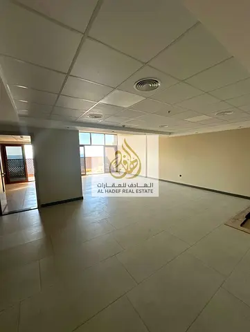 Annual rent in Ajman, Al Bustan area, near Ajman Museum. The building is suitable for families. Apartment includes two bedrooms, a living room, a maid