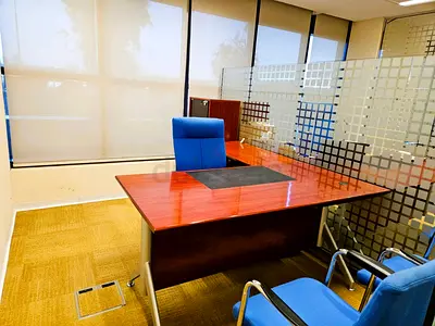L shaped Managers desk with 3 side drawers and a revolving chair
