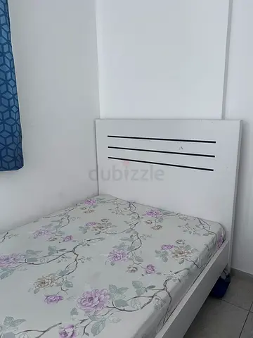 White single bed frame with floral mattress included