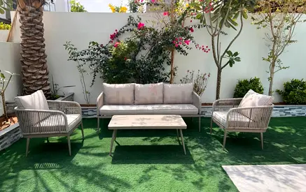 Outdoor 4-piece rattan-style sofa set with cushions — excellent condition