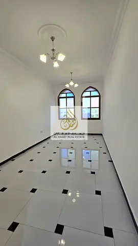 Annual rent in Ajman, Al Rawda 3 area, near Sheikh Ammar Street. Families only. One-bedroom apartment with living room, central air conditioning, two