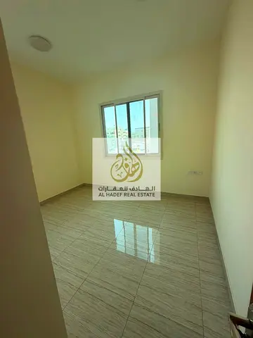 For rent in Al Rashidiya 2, Ajman: one bedroom, living room, two bathrooms, and balcony. Close to Ladies Park. Excellent location. Rent: 30,000 AED. P