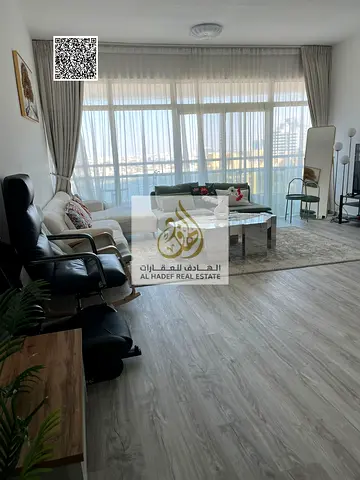 Two-bedroom apartment for sale in cash in Horizon Towers, Al Rashidiya, Ajman, overlooking Ajman Creek, freehold ownership.