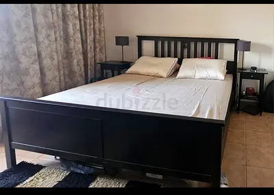 Solid dark wood double bed frame with slatted headboard - good condition