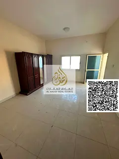 3BR + hall in Al Nuaimiya 1 on Al Ittihad St, 2 balconies, built-in wardrobes, central AC. Opposite
