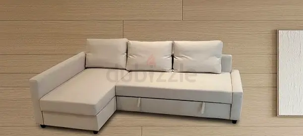 Light beige L-shaped sectional sofa bed with storage, good condition