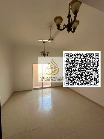 For annual rent in Ajman, Al Nuaimiya, directly on Al Ittihad Street: 2 bedrooms, living room, 2 ba