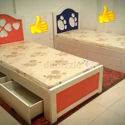 Pair of single beds with under-bed drawers with mattress