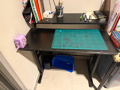 Compact black study desk with raised shelf - good condition