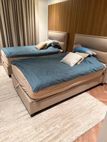 Pair of single upholstered beds with headboards - good condition