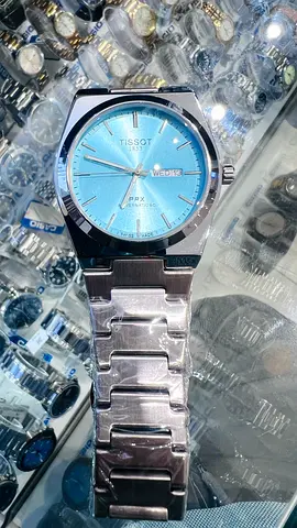 Tissot PRX with blue sunburst dial - stainless steel mens watch