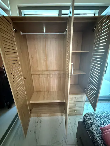 Three-door wooden wardrobe with hanging rail and drawers - good condition