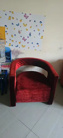 Single red velvet lounge chair with curved back — good condition 0508148117