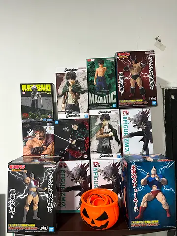 Collection of Anime Action Figures in Original Boxes.