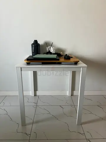 Simple white side table with wood top — sturdy and compact