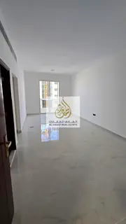 Annual rent in Ajman, Al Jurf 2 area, near the school complex. Two-bedroom apartment with a living r