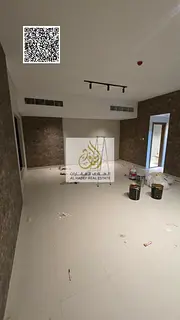 Three-bedroom apartment with a living room, maid's room, and parking available for annual rent i