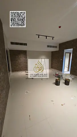 Three-bedroom apartment with a living room, maid's room, and parking available for annual rent in Al Rashidiya 1.